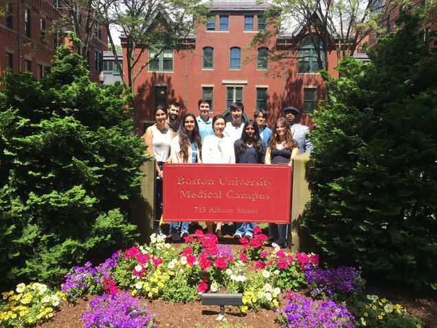 Lab team gathering outside the medical campus